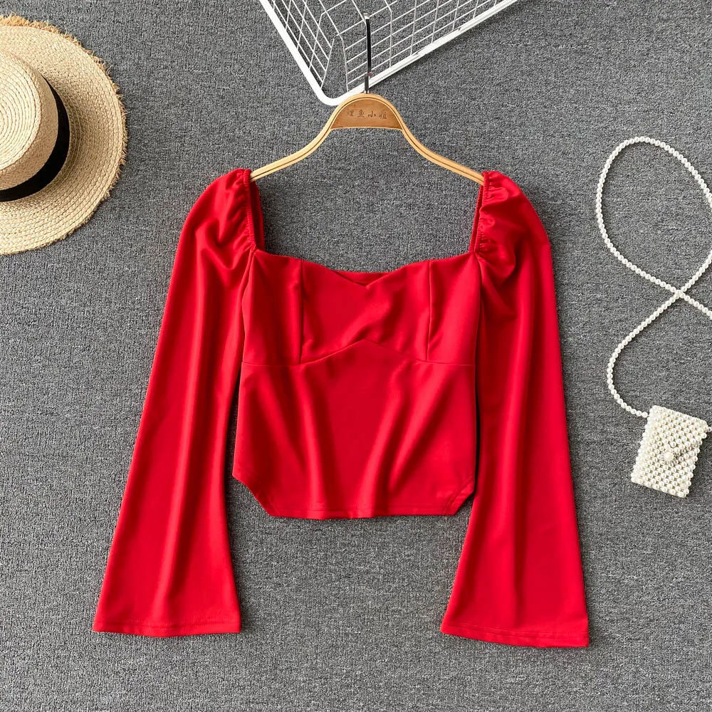 

exposed collarbone shirt women's new 2021 foreign style fashion design sense of minority slim and exposed navel blouse