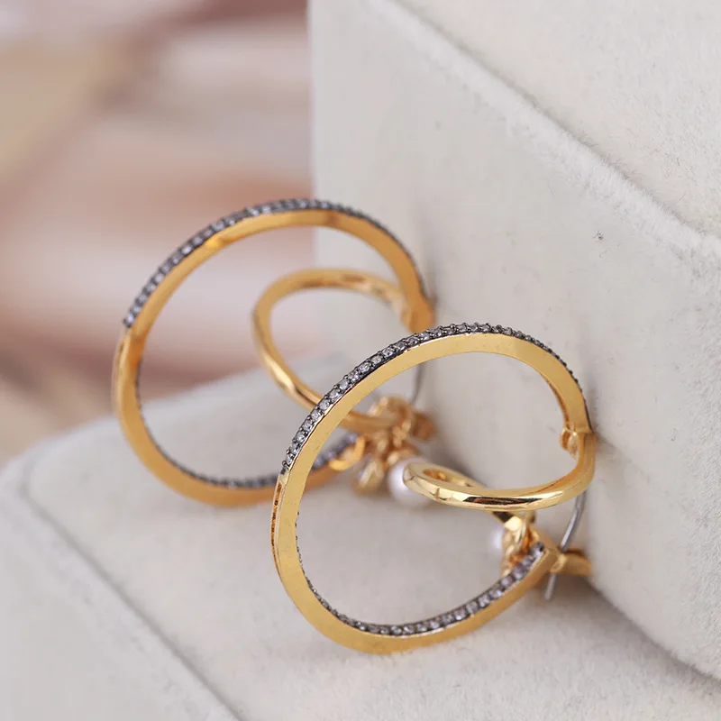 

Fashion gold earrings inlaid with zircon three-dimensional circles