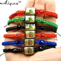 12 pieces san judas and virgin mary jesus saint benedict alloy and wood hand woven bracelets can be used as gifts and prayers
