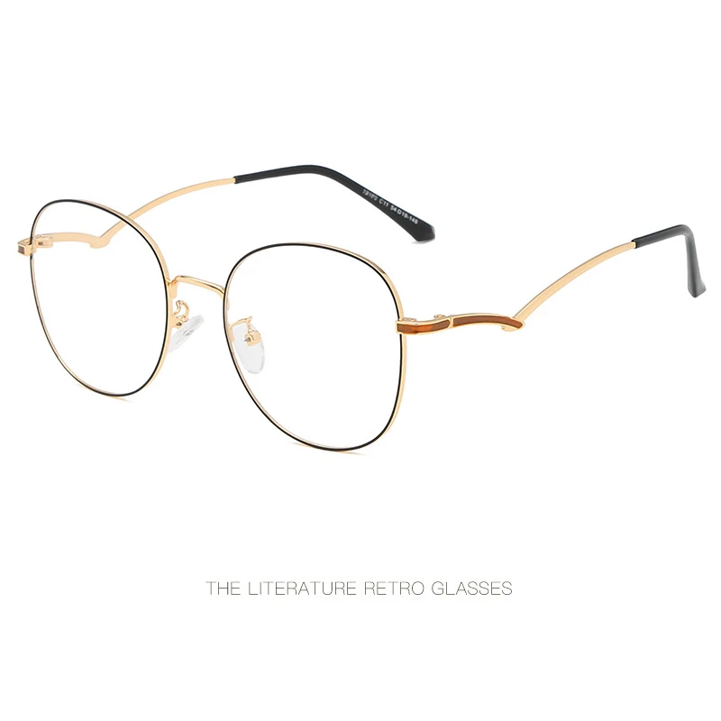 

New retro metal glasses frame Fashion oval literary glasses frame Personality two-color design mirror legs trend flat mirror.