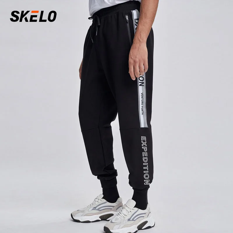 Леггинсы мужские спортивные с карманами эластичные свободные для бега 2021