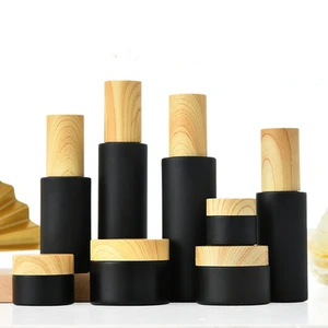 Black Matte Luxury glass spray Pump Lotion Containers 50g 50ml Skincare Packaging Cosmetic Bottles Jars with Wood grain cover Black Matte Luxury glass spray Pump Lotion Containers 50g 50ml Skincare Packaging Cosmetic Bottles Jars with Wood grain cover