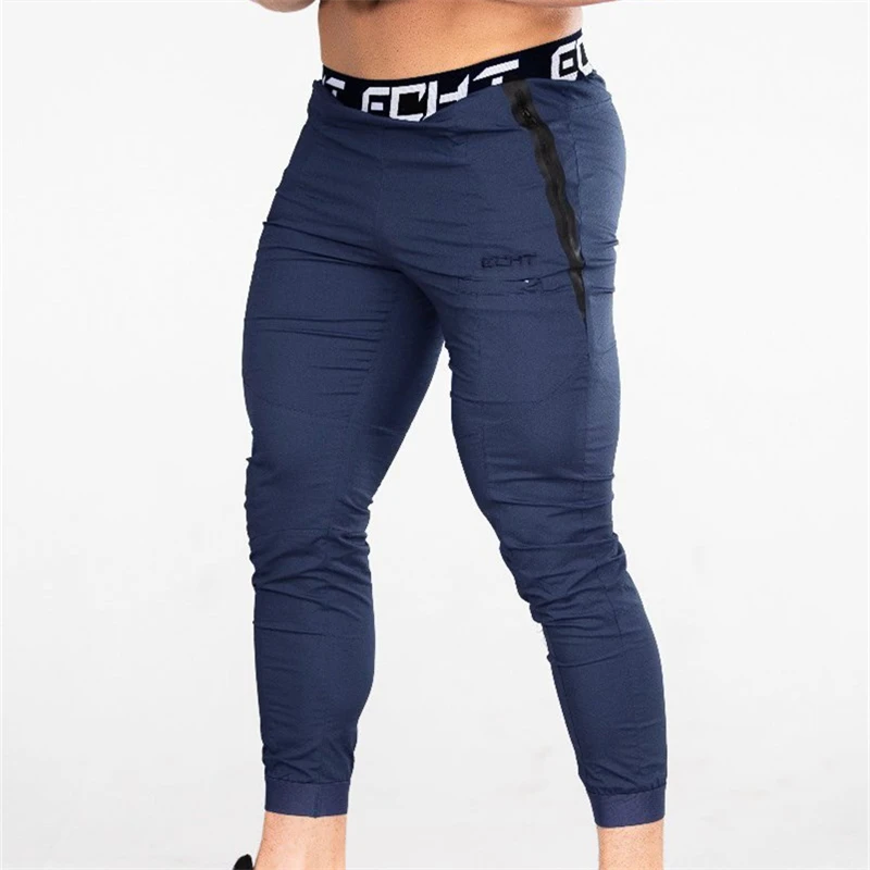 

Men 2019 Fashion Sweatpants Casual zipper pants New Fitness Trousers Stitching Elastic Soft Slim Fit Sports Pencil Pants