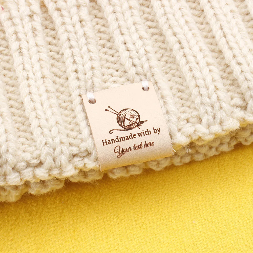 

Custom Labels, Centre Fold Leather Labels, Sewing Labels, Logo or Text, Knitting Tags For Hats, Engraved Label (PB3195)