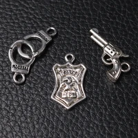 18pcs mix silver plated police badge pistol handcuffs pendant diy charm retro bracelet keychain metal jewelry carfts accessories