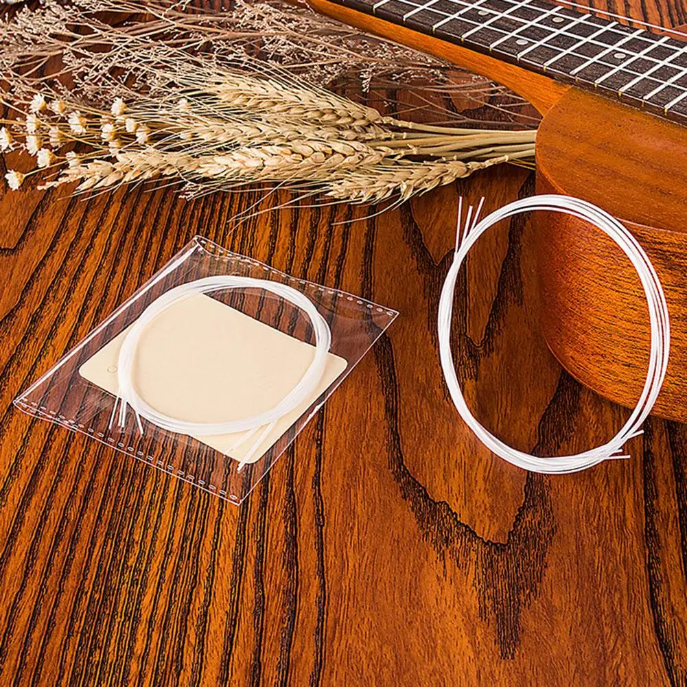

4pcs/set Ukulele/Guitar Strings White Nylon String Replacement Part Universal for 21/23/26in Ukulele Guitar Acoustic Guitar Part