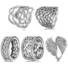 Оригинальное ажурное кольцо в виде дикой розы с красивыми перьями