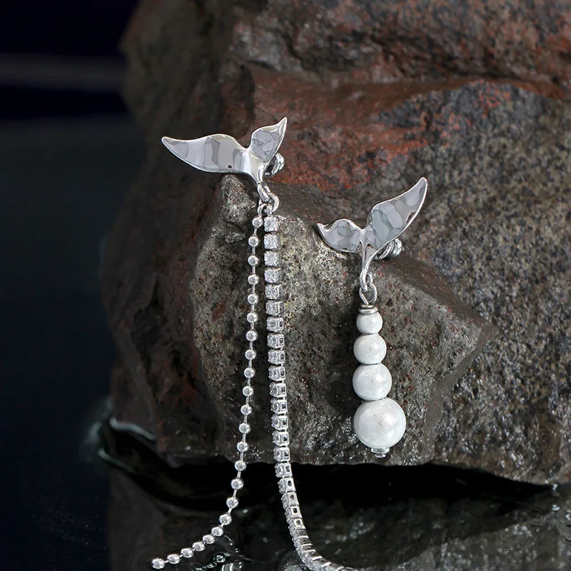 

Fish tail dream bead tassel earrings designer asymmetric long zircon chain earrings cold metal wind.