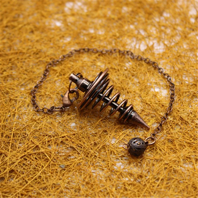 Старинный медный конический молоток в серебряных и золотых подвесках молотках