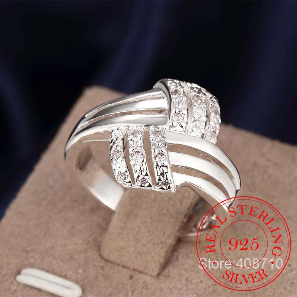 Женское и мужское витое кольцо серебряное с кристаллом из кубического циркония