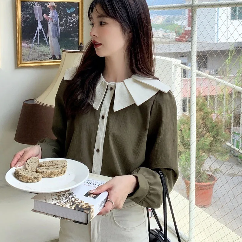 

20221 autumn and winter new women's design sense wrinkled lapel wild show thin color contrast long-sleeved shirt