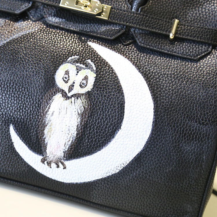 

2020 hot Moonlight painted graffiti cartoon character female handbag European and American fashion luxury large women large bag