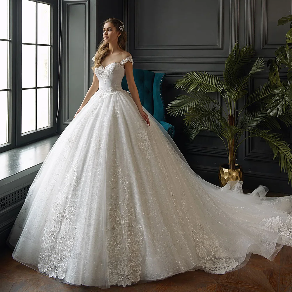 

Muslim Wedding Dresses Ball Gown Cap Sleeves Tulle Lace Appliques Boho Dubai Arabic Wedding Gown Bridal Dress Vestido De Noiva