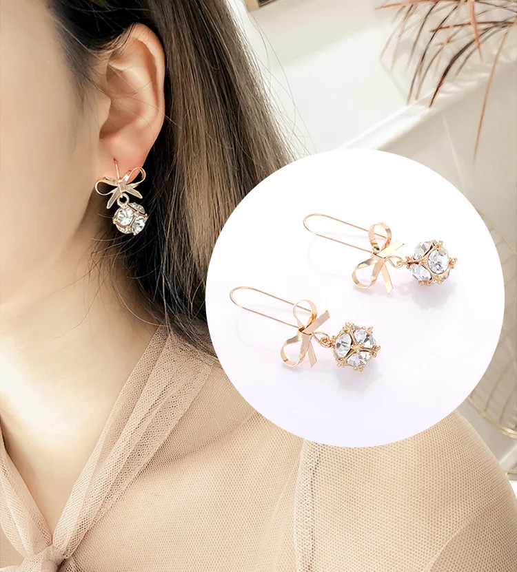 Серьги-гвоздики женские шикарный Шиммер с бантом и белыми кристаллами 2019 |