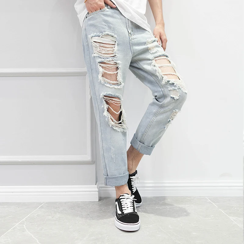 

Japanese Korean Version of The Tide Male Nine Pants Pants Hip-hop Big Hole Pants Knees Couple Jeans Personality Nightclub Pants