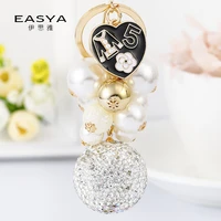 2021 new pearl camellia love keychain fashion exquisite diamond ball pendant pendant lady bag ornament charm gift