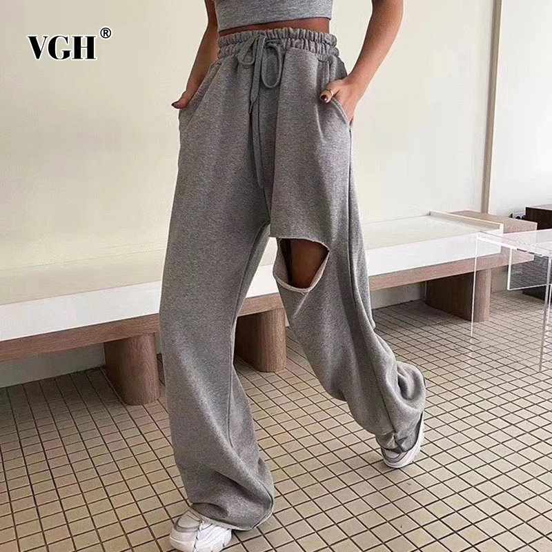 

VGH Casual Loose Sweatpants Women High Waist Lace Up Ripped Hole Asymmetrical Sweat Pants For Female Fashion Clothing Summer New