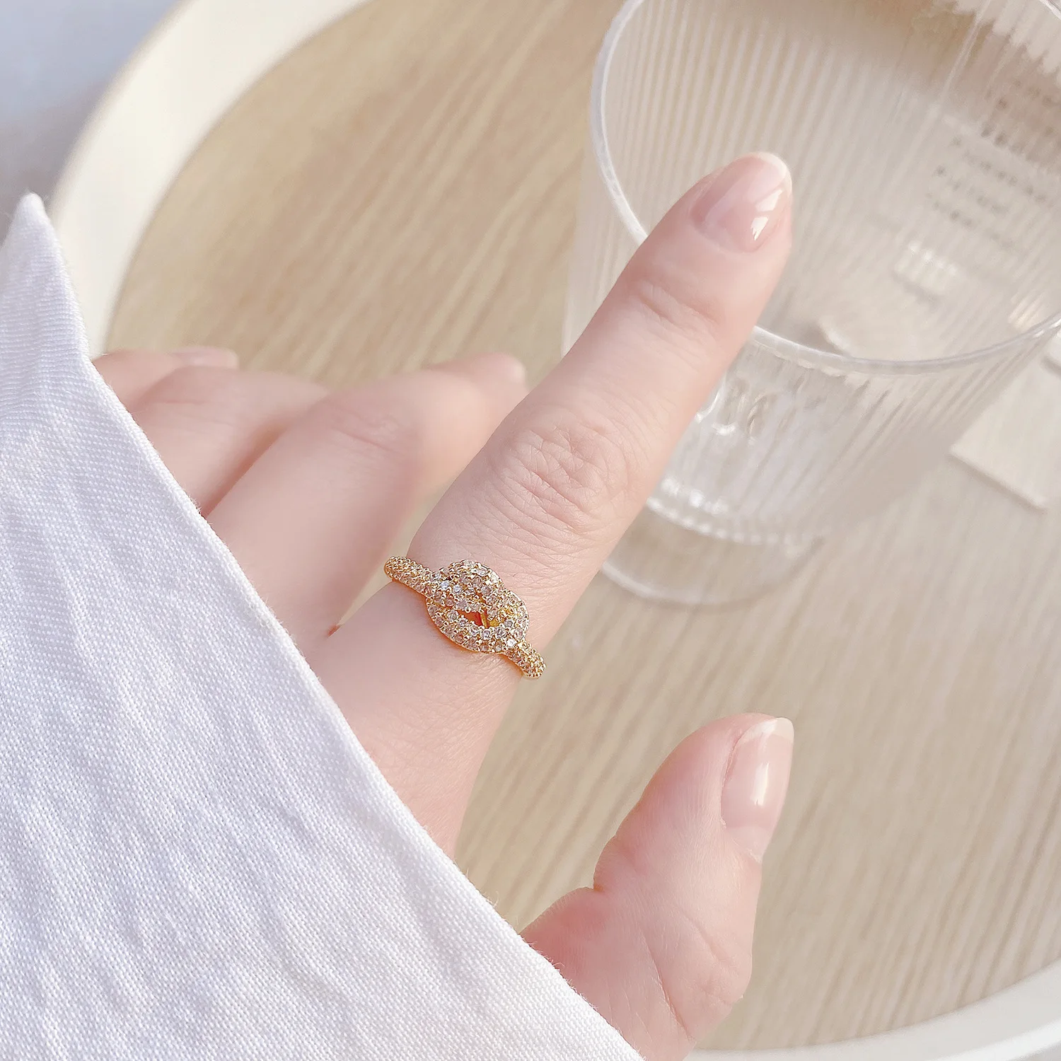

Ins Hot Sale 14K Real Gold Temperament Hollowed Out and Simple Knotted Open Design Cz Ring for Women