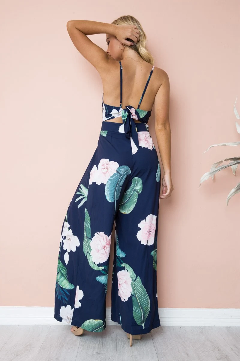 Nadafair Boho Цветочные Комбинезоны для женщин V образным вырезом спинки Лук ремень Летний Пляжный комбинезон длинные брюки