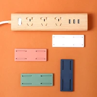 2021 new durable wall mounted punch free plug holder self adhesive plug socket holder cable organizer home storage organization