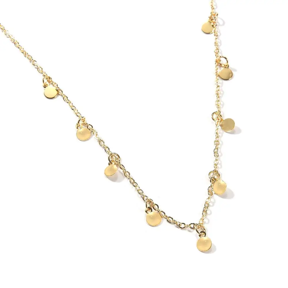 Женское колье чокер золотистого цвета с блестками монетами и кисточками