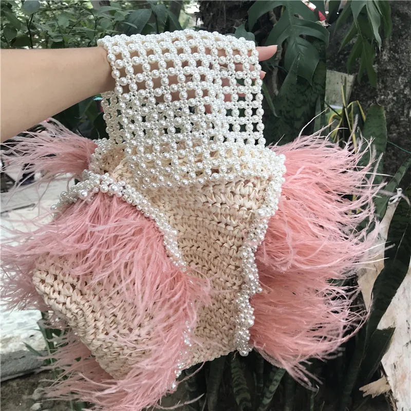 

2020 new vacation style full handmade pink ostrich feather pearl natural grass weaving bag