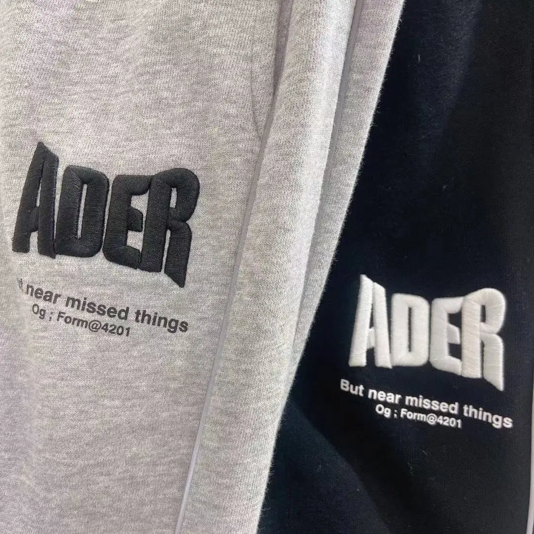 

2021 Ader error spring and autumn new men's pants reflective design street trousers ladies casual sports pants lazy style