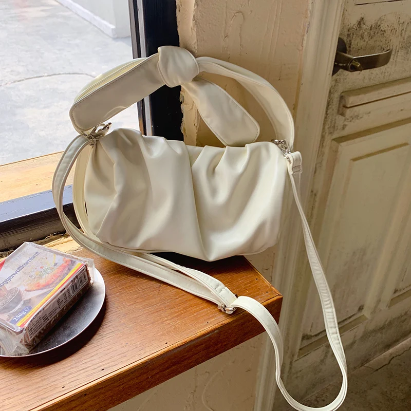 

2021 new fashion women's one shoulder handbag pleated soft dumpling Mini cute hand bag solid color slant span small bag