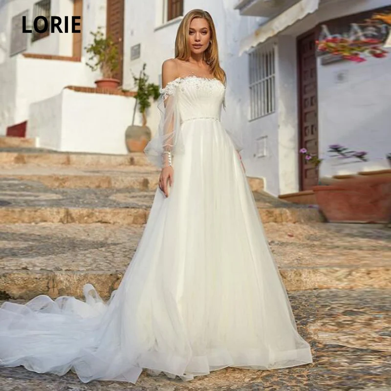 

Великолепные Свадебные платья LORIE с круглым вырезом, кружевными аппликациями, длинными рукавами, пуговицами на спине, трапециевидной формы,...