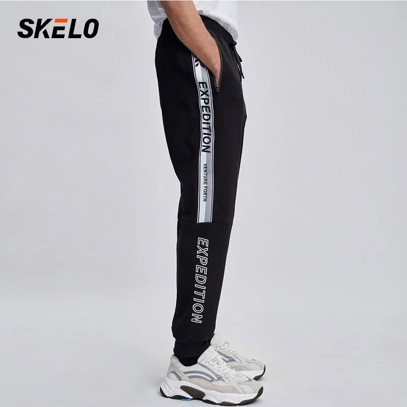 Леггинсы мужские спортивные с карманами эластичные свободные для бега 2021