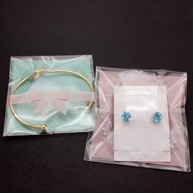 

100pcs 7x7cm Self Adhesive OPP Plastic Package Cute Pink Bow Design Bracelets Earrings Ring Jewelry Gift Bags DIY Party Supplies