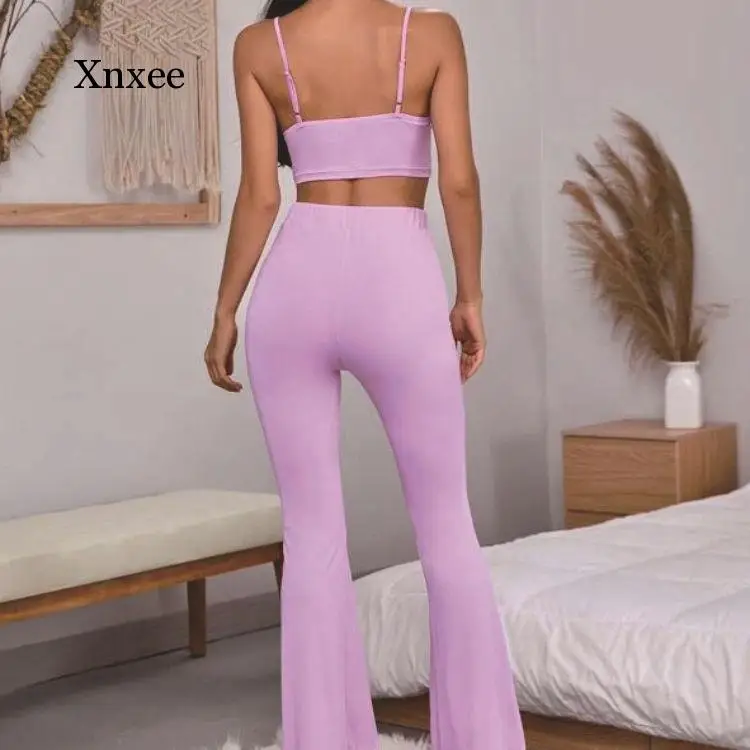 Облегающий пикантный однотонный укороченный топ с рюшами и брюки-клеш комплект