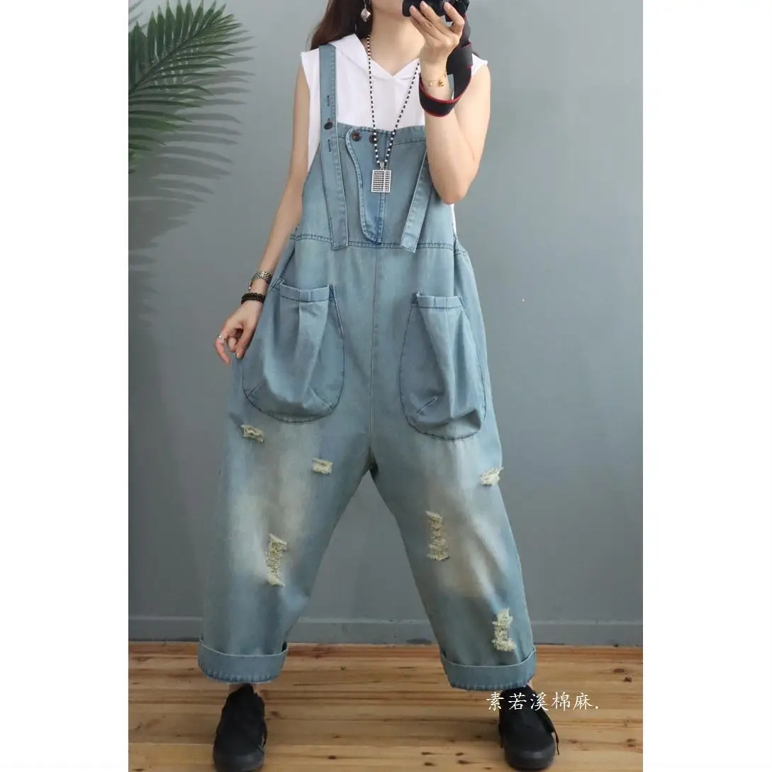 

Fashion personality hole size denim strap pants women's spring and summer new trend big pocket loose show thin pants trend