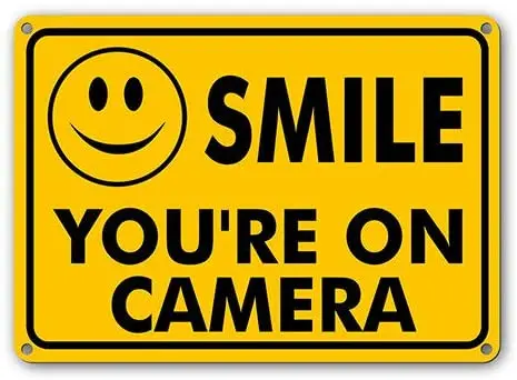 

Smile You’re On Camera Sign Yellow Plastic Metal Sign