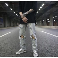 european and american style high street classic wash water to make old light blue folding cat scratch slim hole jeans for men