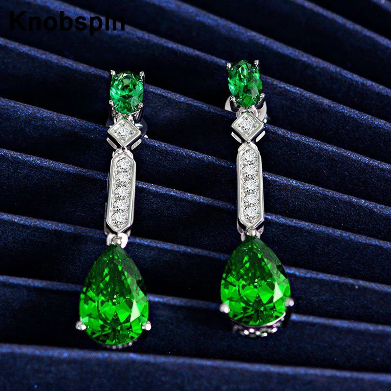 

Серьги женские из серебра 100% пробы с изумрудами 8 х12 мм