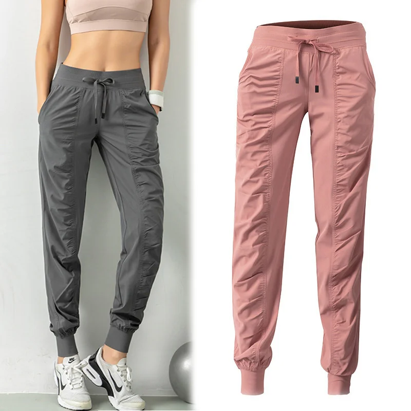 

Running pants with drawstring for use in training, sports sweatpants and quick drying pants with two side pockets for exercise