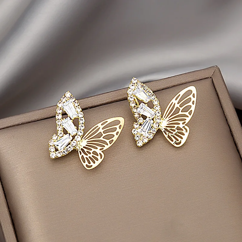 

Origin Summer Korean Bling Bling Asymmetric Butterfly Dangle Earrings for Women Gold Rhinestones Hollow Metal Earrings Jwellery