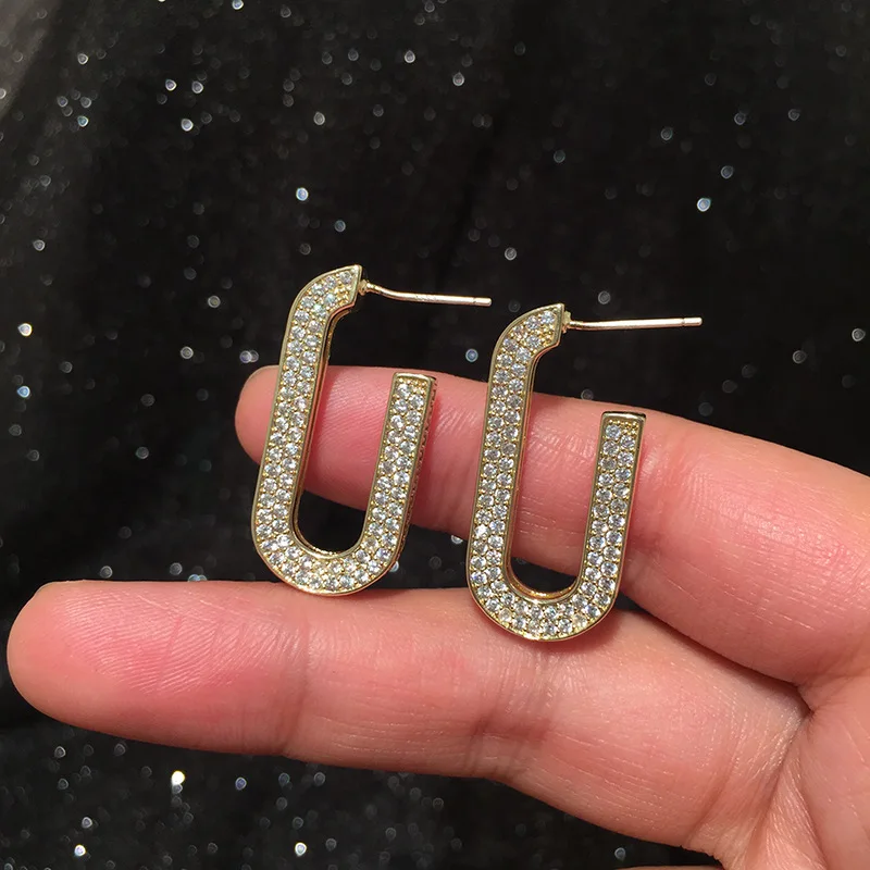 

Geometric oval earrings retro Hong Kong wind S925 silver needle luxury metal wind thin face earrings slim temperament earrings