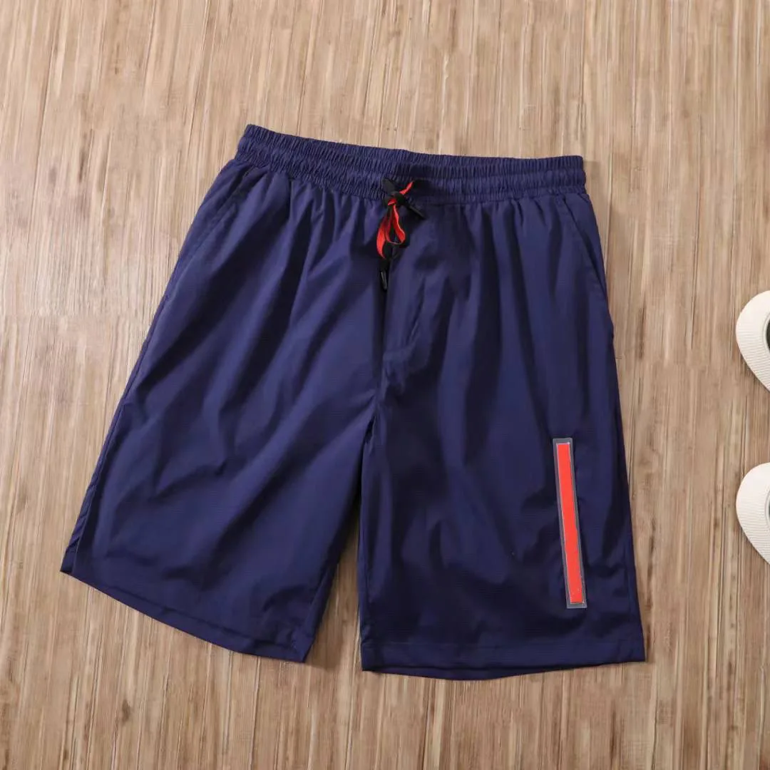 

2021 summer new men's and women's five-point pants swimming solid color casual beach quick-drying net lining couple shorts