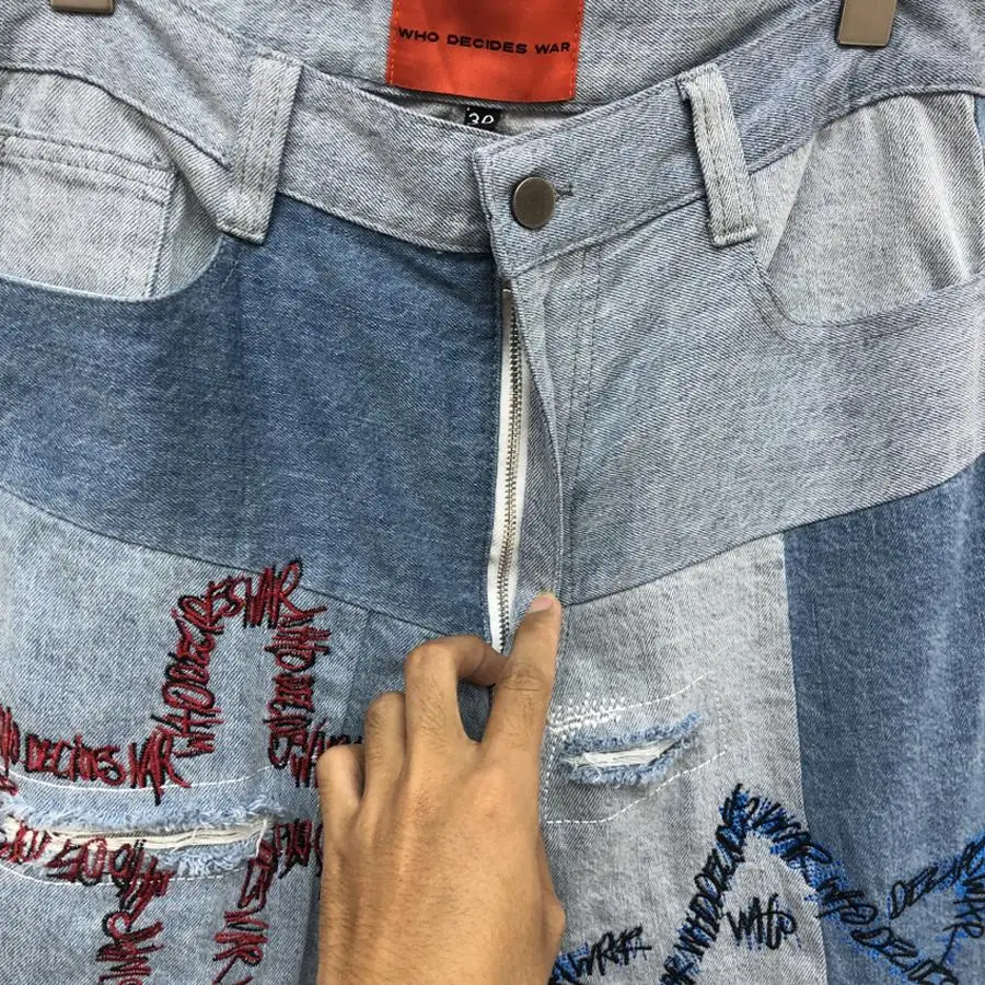 

Top Version Who Decides War Jeans Men Women Embroidery Graffiti Hole Damage Denim Pants Slim Fit Jean
