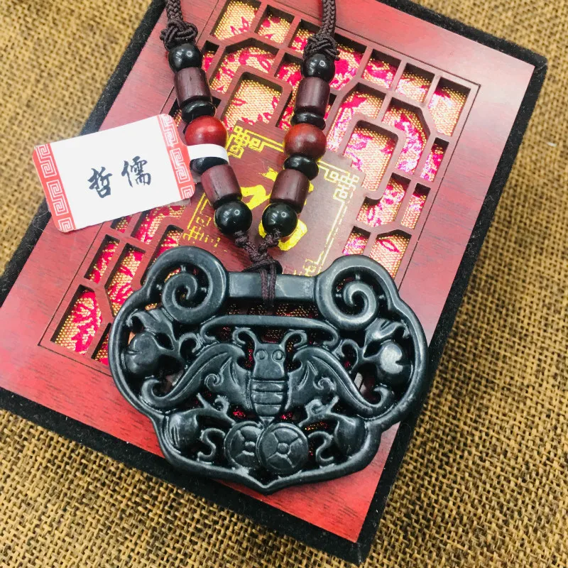 

Authentic natural black stone hand-carved black retro hollow lock pendant necklace men and women delicate sweater chain