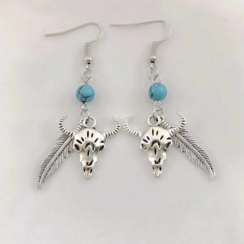 Серьги с бирюзой в виде головы коровы и перьев