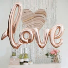 Воздушные шары в форме надписи любовь из розового золота