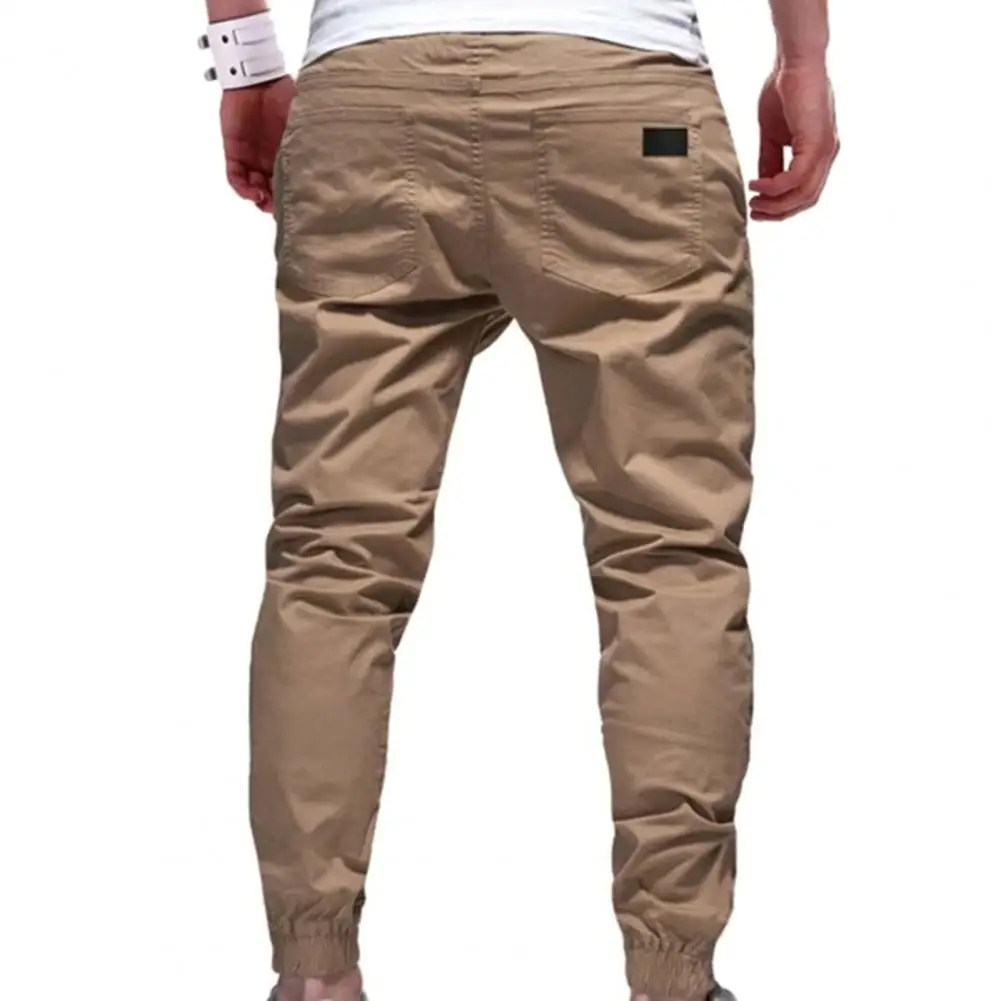 

Multi Pockets Mid Rise Solid Color Drawstring Training Slacks Deep Crotch Trousers Ankle Tied Mid Waist Men Jogging Sweatpants