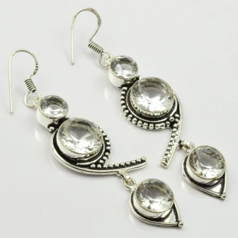 

Белый топаз, серебряная накладка на медные серьги, 70 мм, E2181