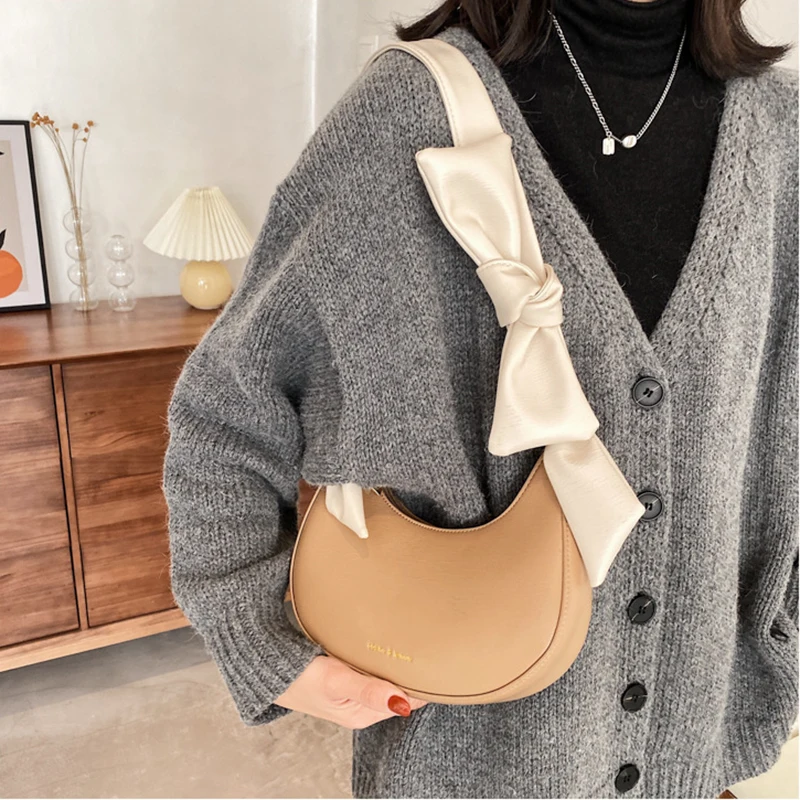 

Vintage Ribbon Strap Solid Color Baguette Handbags For Women Fashion Letter Weave Crossbody Bags 2021 PU Leather Shoulder Purses