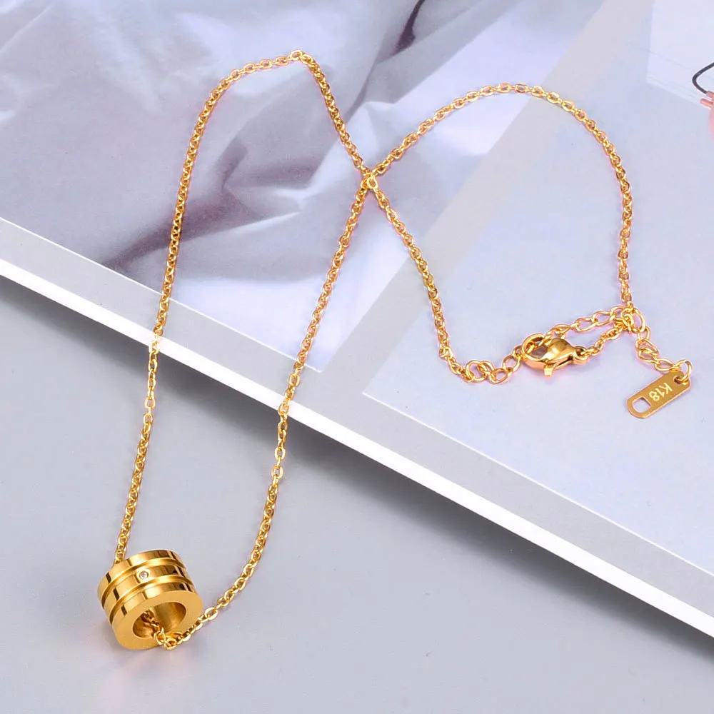 Чокер цилиндрический с двойным пазом маленький кулон золотистого цвета из