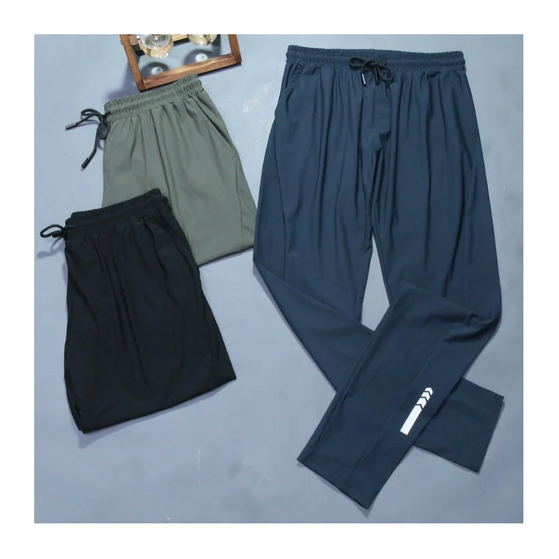 

Man New Jogging Pants Zipper Reflective Soccer Sporting Training Gym Pants Slim Work Elastic Waist Light Thin Cool Men Trousers