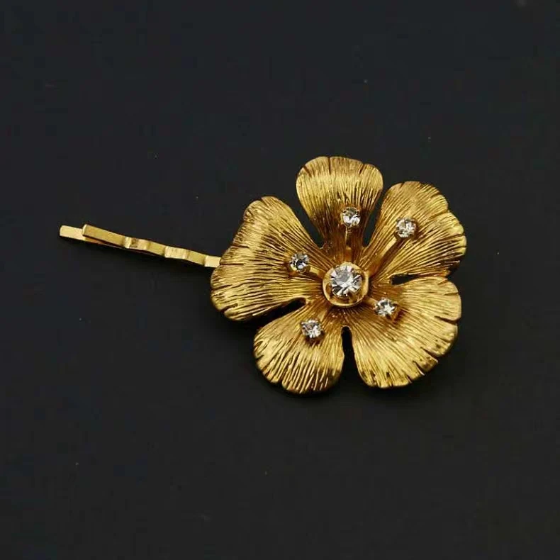 

Rispada gold color flower with diamond hair pins